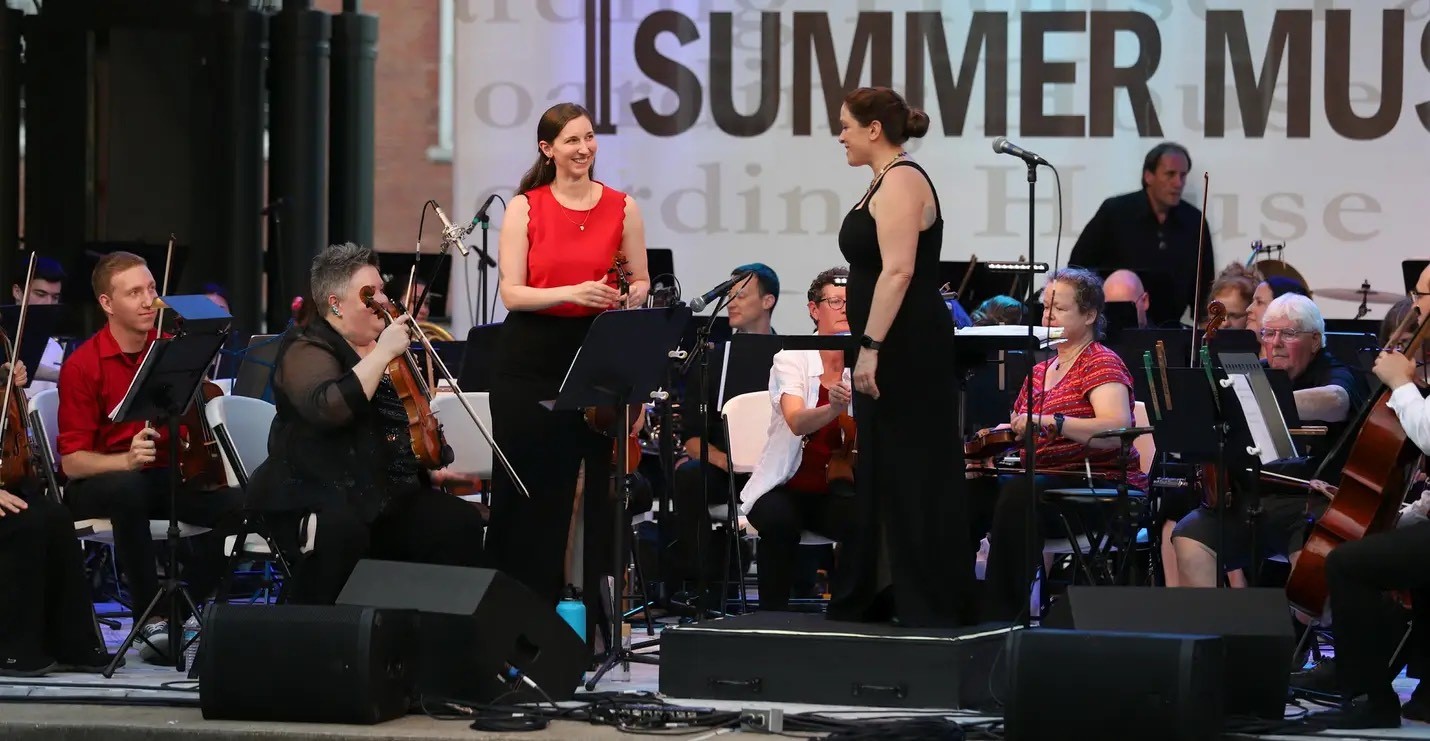 Picture of Brandi Main finishing solo performance with the New England Film Orchestra